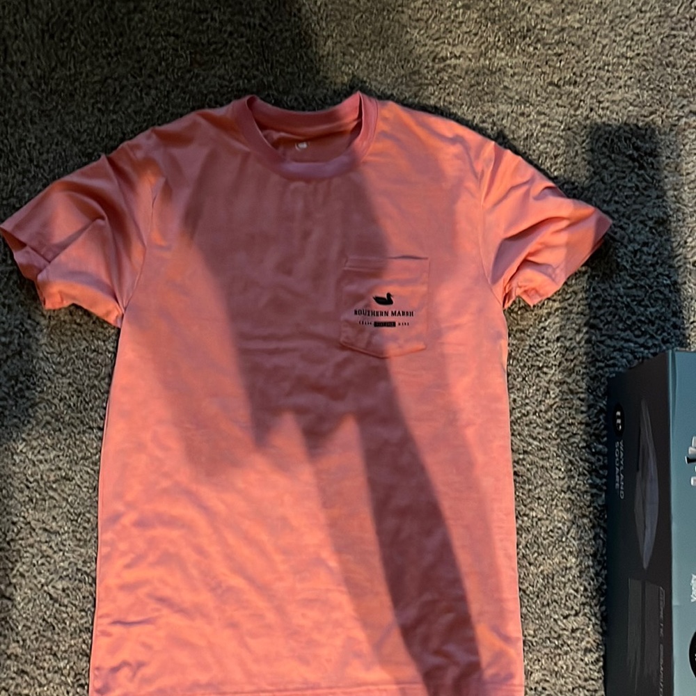 Southern marsh, salmon, colored T-shirt.